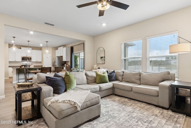 75743 Spoonbill Ln, Yulee, FL 32097 - living room with light wood-style flooring, visible vents, ceiling fan, and recessed lighting