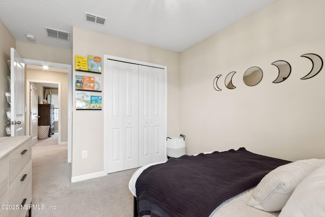 75743 Spoonbill Ln, Yulee, FL 32097 - bedroom with a closet, light colored carpet, baseboards, and visible vents