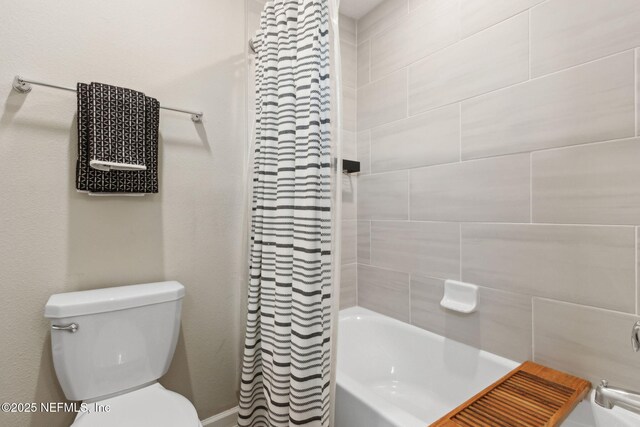 75743 Spoonbill Ln, Yulee, FL 32097 - bathroom with toilet and shower / bathtub combination with curtain