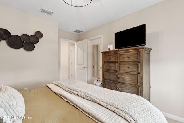 75743 Spoonbill Ln, Yulee, FL 32097 - carpeted bedroom featuring baseboards and visible vents