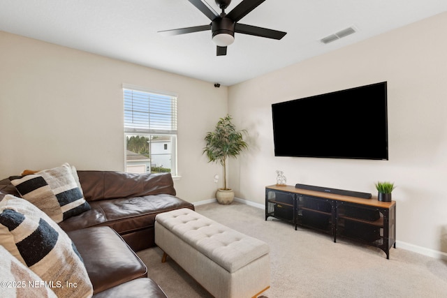 75743 Spoonbill Ln, Yulee, FL 32097 - living room featuring carpet flooring, baseboards, a ceiling fan, and visible vents