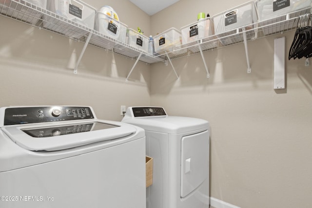 75743 Spoonbill Ln, Yulee, FL 32097 - laundry area featuring washing machine and dryer and laundry area