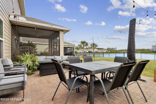 75743 Spoonbill Ln, Yulee, FL 32097 - view of patio / terrace with an outdoor hangout area, outdoor dining area, ceiling fan, a water view, and fence