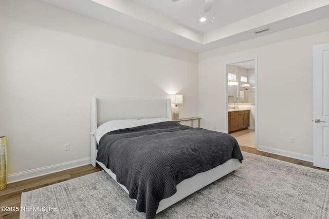 bedroom with visible vents, light wood-style flooring, recessed lighting, and baseboards