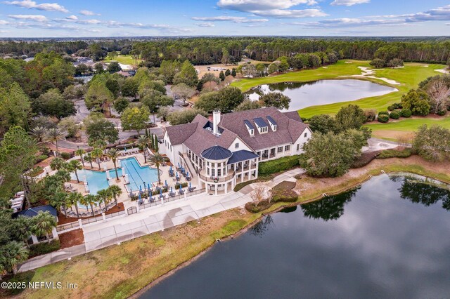 birds eye view of property with a water view, golf course view, and a forest view