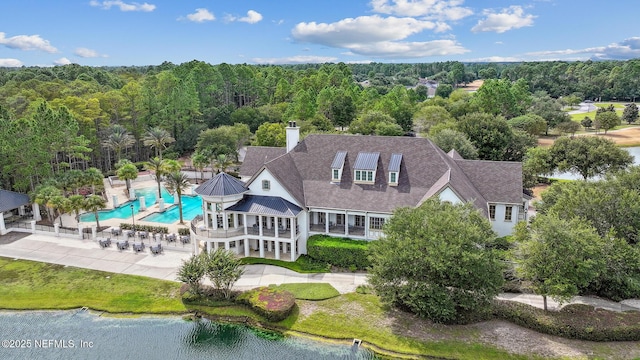 bird's eye view with a water view and a view of trees