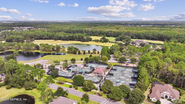 aerial view with a water view, a forest view, and view of golf course