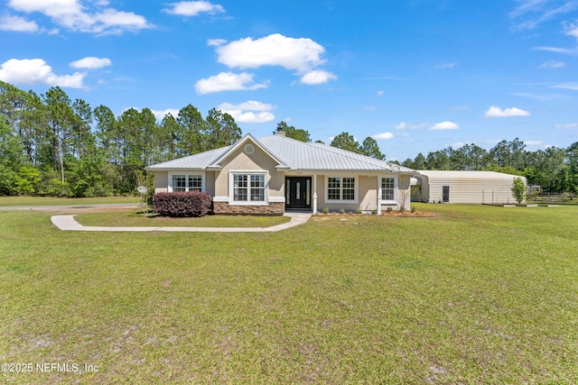 12531 County Road 121, Bryceville, FL 32009 - view of front facade with stucco siding, stone siding, and a front lawn