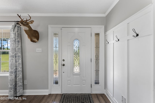 12531 County Road 121, Bryceville, FL 32009 - foyer with dark wood-type flooring, baseboards, ornamental molding, and a textured ceiling