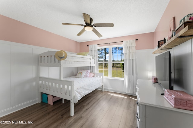12531 County Road 121, Bryceville, FL 32009 - bedroom featuring a textured ceiling, wood finished floors, and a ceiling fan