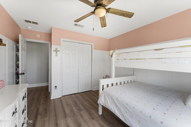 12531 County Road 121, Bryceville, FL 32009 - bedroom with dark wood-type flooring, visible vents, a ceiling fan, and a closet