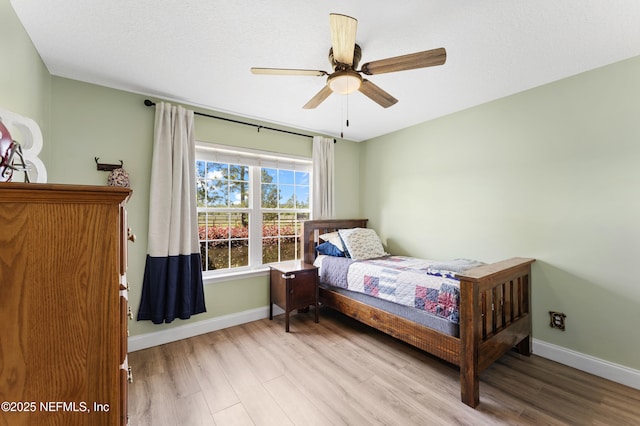 12531 County Road 121, Bryceville, FL 32009 - bedroom featuring baseboards, ceiling fan, and wood finished floors