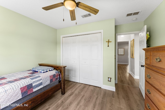 12531 County Road 121, Bryceville, FL 32009 - bedroom with visible vents, baseboards, a closet, and wood finished floors