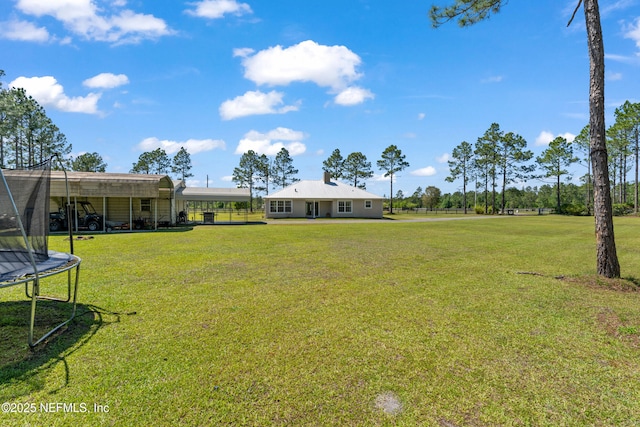 12531 County Road 121, Bryceville, FL 32009 - view of yard featuring a carport and a trampoline