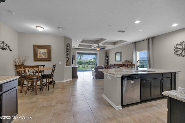 kitchen with a sink, a healthy amount of sunlight, recessed lighting, and dishwasher