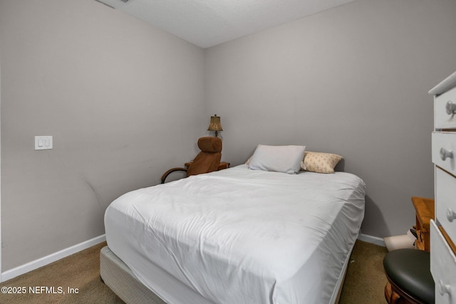 carpeted bedroom featuring baseboards
