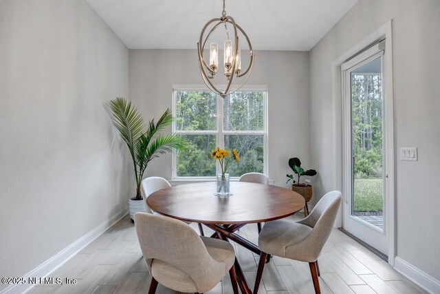 145 Bridgeton St, Saint Johns, FL 32259 - dining room with a chandelier, light wood-type flooring, and baseboards