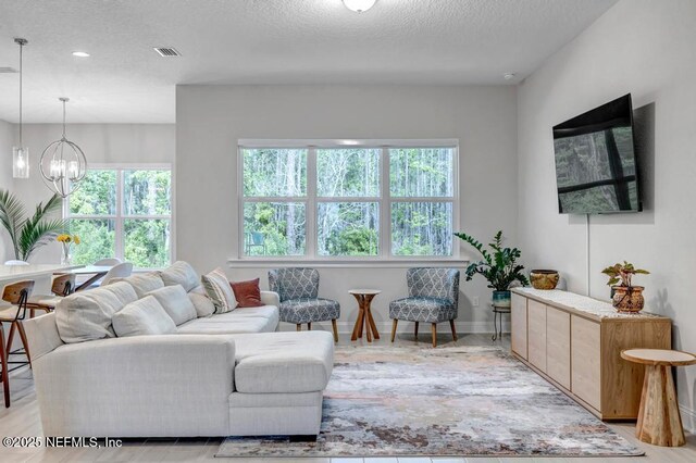 145 Bridgeton St, Saint Johns, FL 32259 - living area with a chandelier, a textured ceiling, visible vents, and recessed lighting