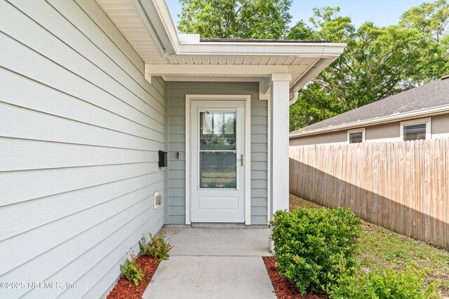 property entrance featuring fence