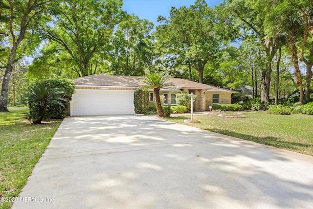 view of front facade featuring concrete driveway, a garage, and a front lawn