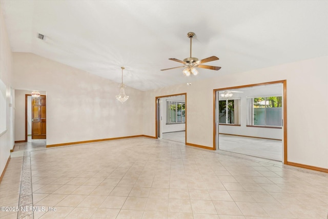 spare room with light tile patterned floors, ceiling fan, baseboards, and lofted ceiling
