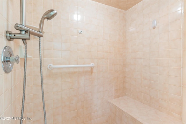 full bath featuring tiled shower