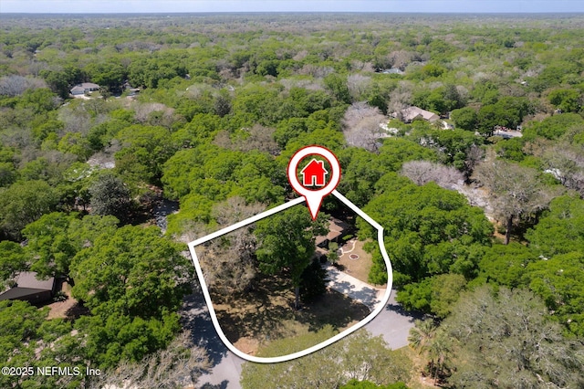 bird's eye view featuring a view of trees
