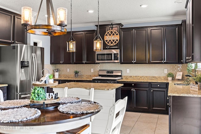 112 Bluffton Ct, Saint Augustine, FL 32092 - kitchen featuring dark brown cabinetry, light tile patterned flooring, stainless steel appliances, and a sink