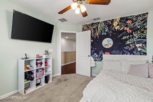 112 Bluffton Ct, Saint Augustine, FL 32092 - bedroom with visible vents, a ceiling fan, baseboards, a textured ceiling, and carpet flooring