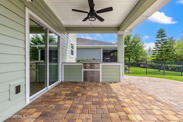 112 Bluffton Ct, Saint Augustine, FL 32092 - view of patio / terrace with an outdoor kitchen, grilling area, a ceiling fan, and fence