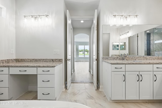 bathroom featuring baseboards, recessed lighting, marble finish floor, and vanity