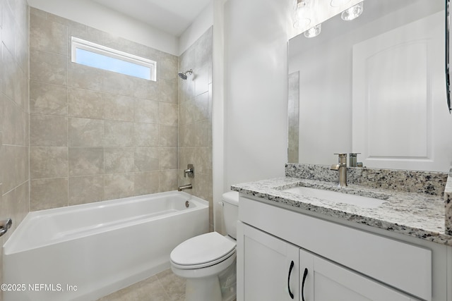 bathroom featuring tile patterned floors, toilet, bathtub / shower combination, and vanity