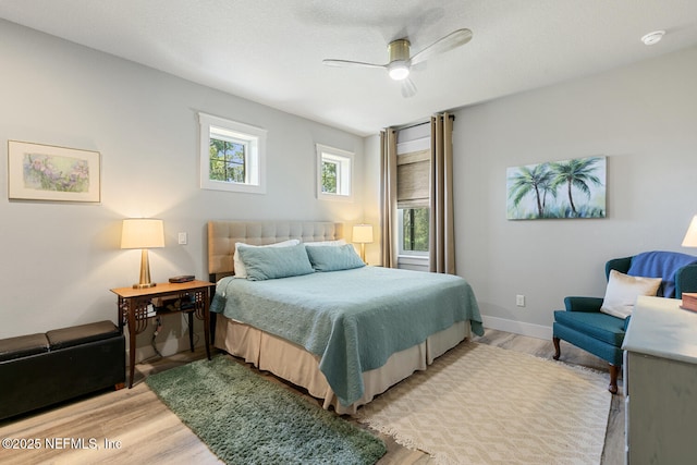 355 Lambert Ave, Flagler Beach, FL 32136 - bedroom with light wood finished floors, baseboards, and ceiling fan