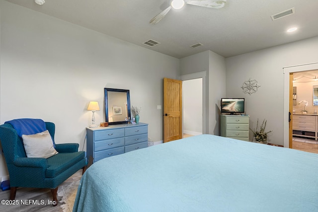 355 Lambert Ave, Flagler Beach, FL 32136 - bedroom with ensuite bath, visible vents, and ceiling fan
