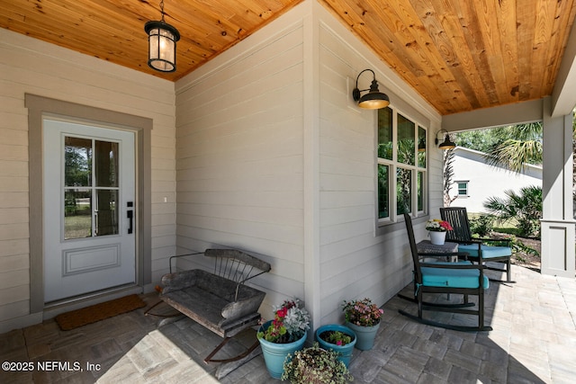 355 Lambert Ave, Flagler Beach, FL 32136 - property entrance with a porch