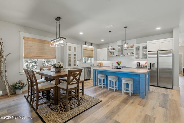 355 Lambert Ave, Flagler Beach, FL 32136 - dining area with recessed lighting, light wood-type flooring, and baseboards