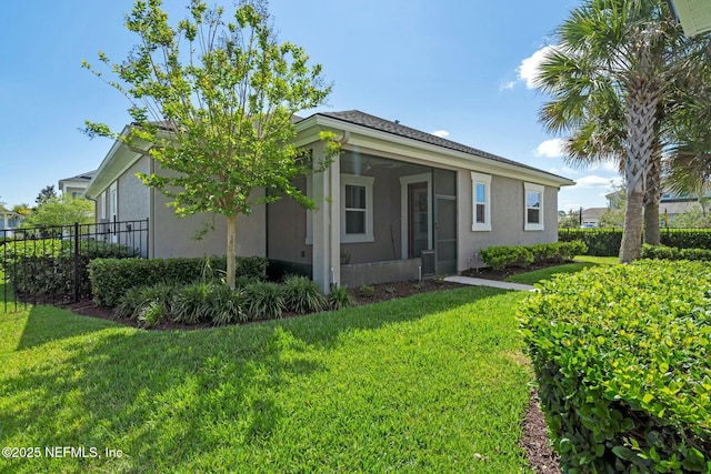114 Fremont Ave, Saint Augustine, FL 32095 - exterior space with stucco siding, fence, and a lawn