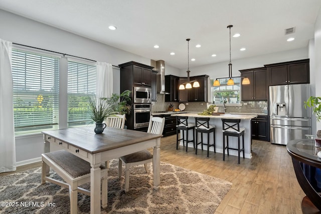 114 Fremont Ave, Saint Augustine, FL 32095 - dining space featuring light wood-style flooring, visible vents, and recessed lighting