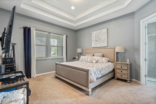 114 Fremont Ave, Saint Augustine, FL 32095 - bedroom featuring a tray ceiling, baseboards, and light colored carpet
