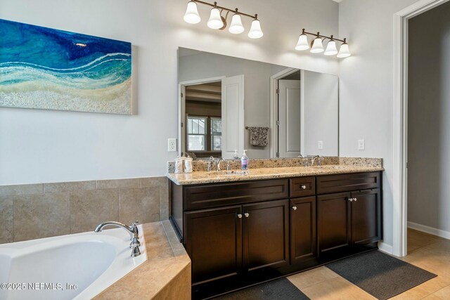 114 Fremont Ave, Saint Augustine, FL 32095 - bathroom featuring a sink, tile patterned floors, and a bath