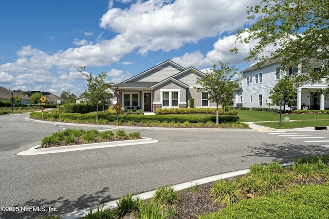 114 Fremont Ave, Saint Augustine, FL 32095 - view of front of home featuring stone siding and a front lawn