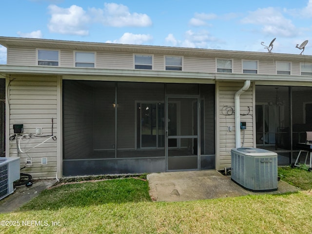 1825 Lago Del Sur Dr, Middleburg, FL 32068 - rear view of property featuring a yard, central air condition unit, and a sunroom