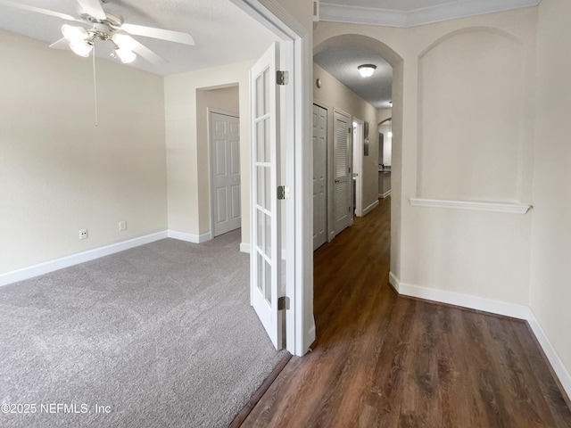 1825 Lago Del Sur Dr, Middleburg, FL 32068 - hallway featuring carpet flooring, baseboards, and arched walkways