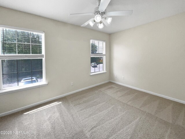1825 Lago Del Sur Dr, Middleburg, FL 32068 - empty room with carpet floors, ceiling fan, and baseboards