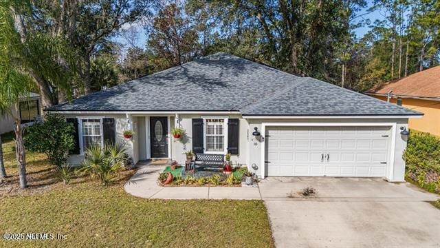 ranch-style home with a garage, a shingled roof, stucco siding, and concrete driveway