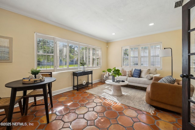 living area with crown molding, recessed lighting, a wealth of natural light, and visible vents