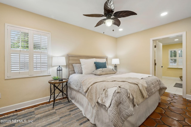 tiled bedroom featuring baseboards, multiple windows, a ceiling fan, and recessed lighting