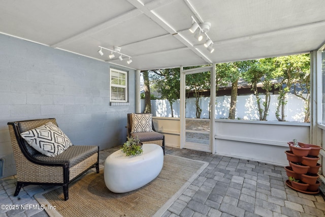 sunroom / solarium with track lighting