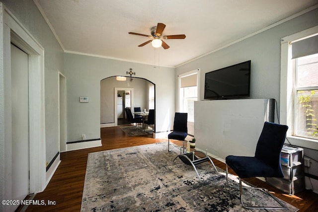 831 Ashford St, Jacksonville, FL 32208 - sitting room featuring a ceiling fan, plenty of natural light, wood finished floors, ornamental molding, and arched walkways