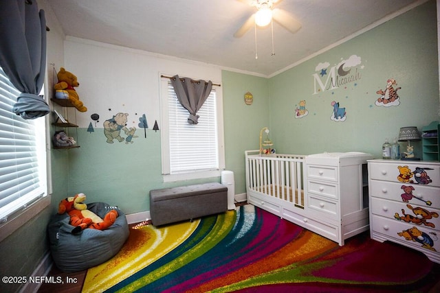 831 Ashford St, Jacksonville, FL 32208 - bedroom featuring crown molding, baseboards, and a crib